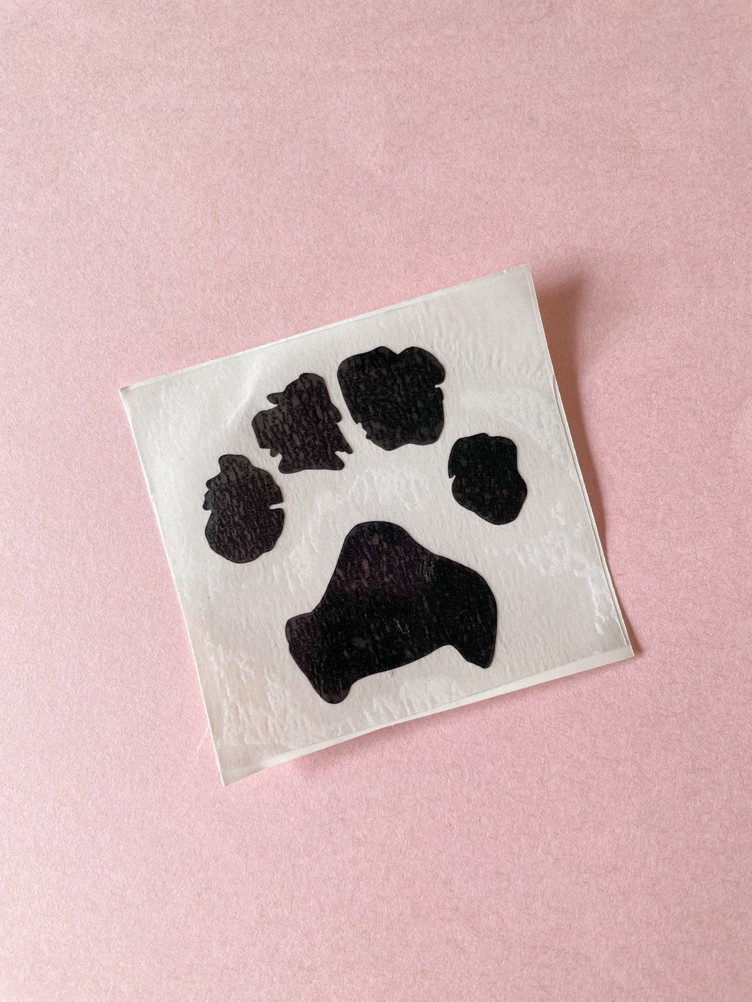 custom paw print vinyl sticker on backing sheet